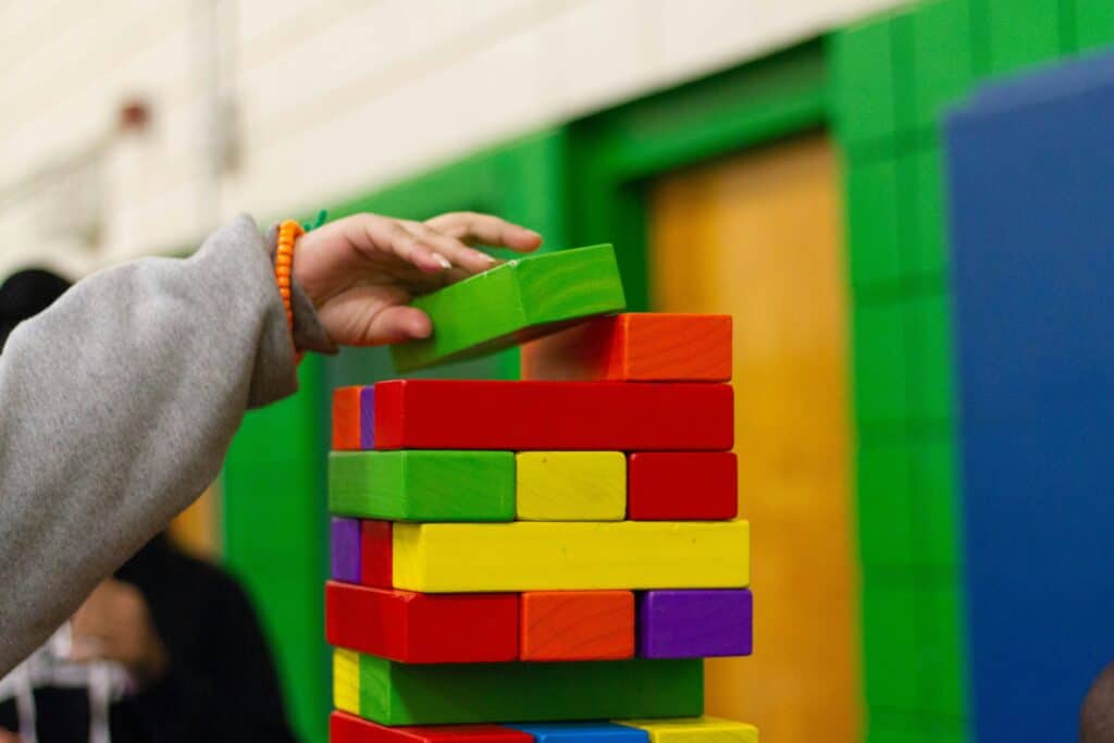OCD. A child stacking colorful blocks